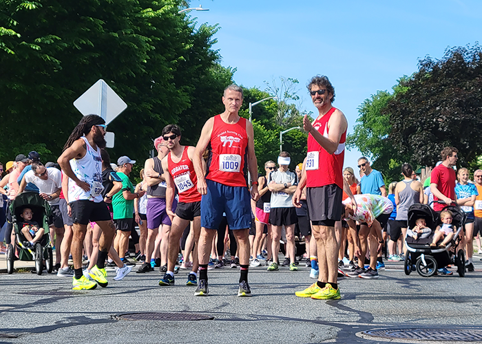 Image of runners at the start of the race at Salem Sound's Run for the Beach 5K.